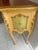 Small Florentine Accent Table with a creamy yellow background with a light green accent, and hand painted flowers, and...