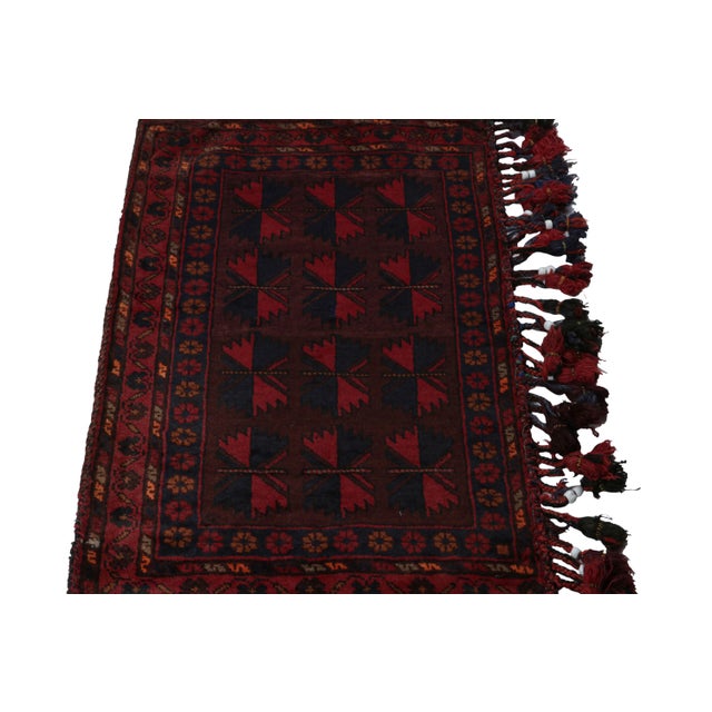Hand knotted in wool, this 6x8 Baluch rug represents a new line of tribal carpets in the Modern Classics Collection by Rug...