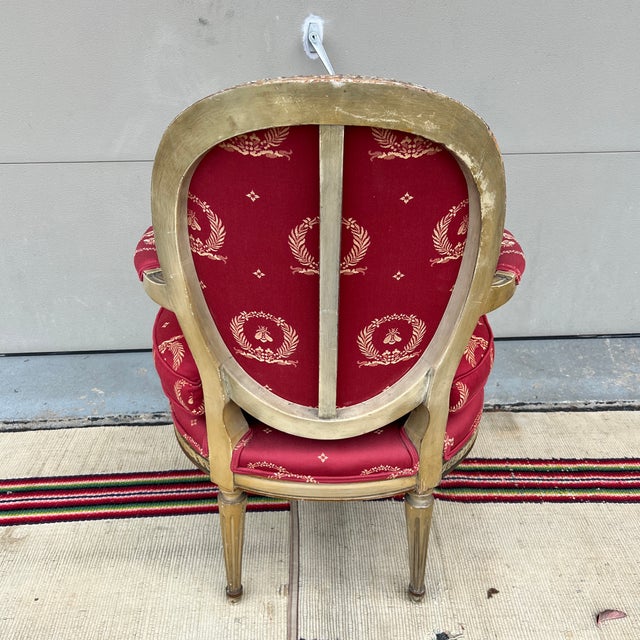 A Vintage Red Upholstered Painted Decorated and Carved French Bergere Arm Chair For Sale - Image 10 of 12