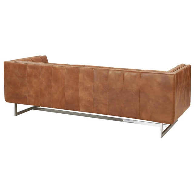 "The Taylor leather living room collection features a classic tufted leather body and contemporary stainless steel base....