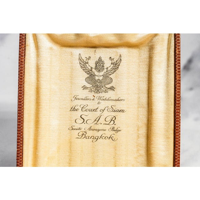 An exceptional example of early 20th-century luxury, this elegant 1920s silver cigarette case is a remarkable survivor,...