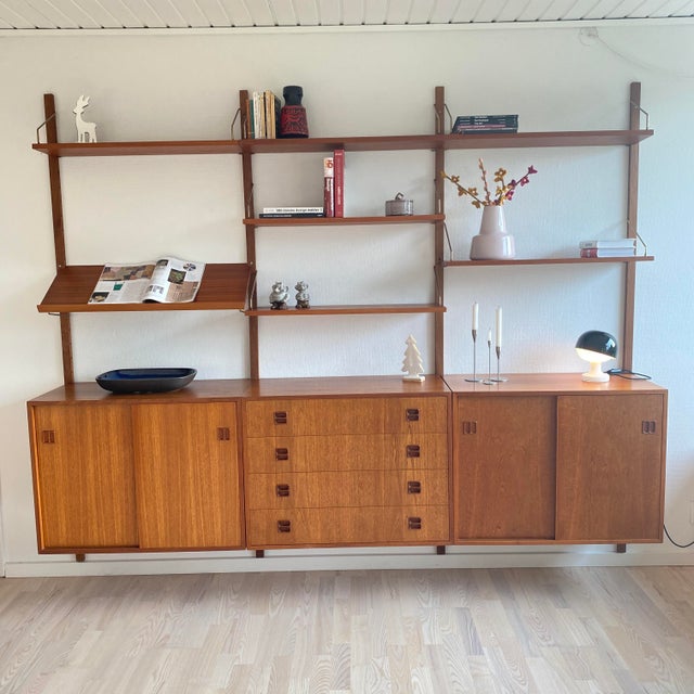 Danish vintage modular shelv wall unit manufactured in denmark in the 1960s -70s. This shelving teak wall unit with 3...