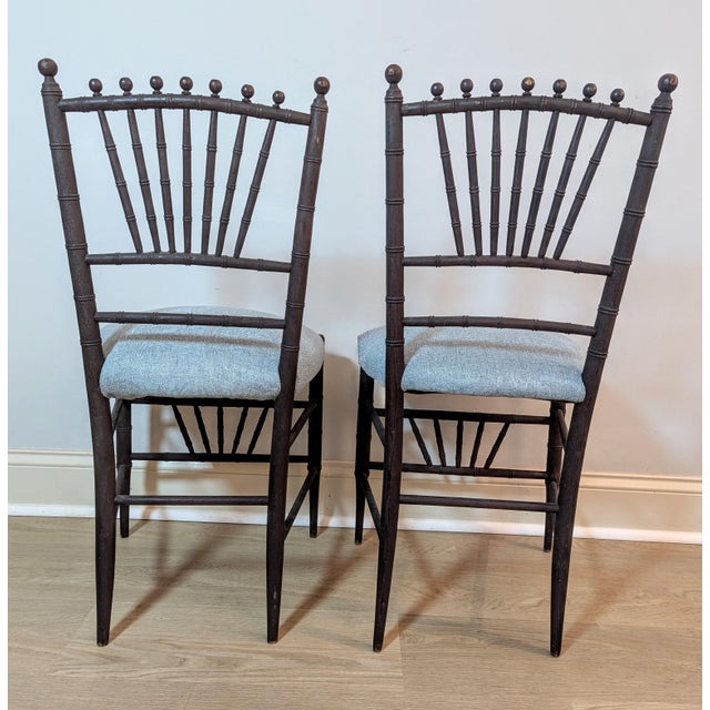 A stunning and rare pair of late 19th-century American Aesthetic Movement faux bamboo side chairs, circa 1880. Strongly...