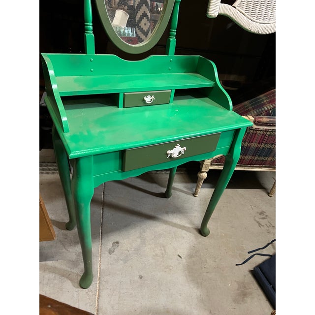 Up for consideration is a beautiful Kelly green wooden vanity with flipping mirror. This would look lovely in your home...