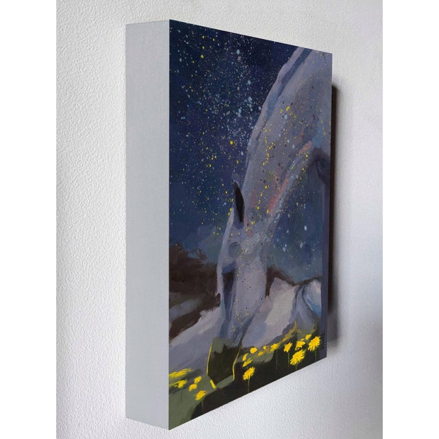 Stardust depicts a serene horse grazing amidst a field of vibrant dandelions, set against a starry night sky. The artist...