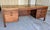 This is a mid 20th century Jens Risom executive desk, manufactured in the late 50s, early 60s of American walnut veneer...