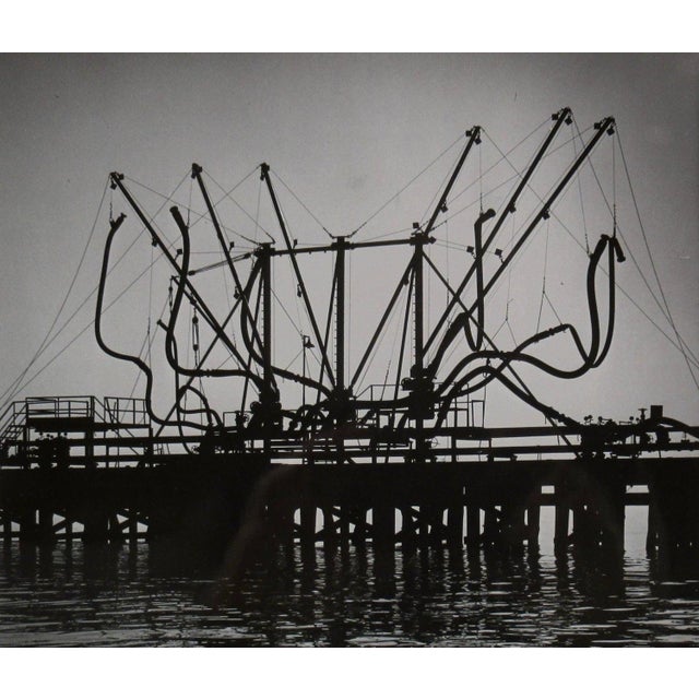 This Photograph titled "Oil Peir (Pier)" c.1960, is a gelatin silver print by noted photographer Richard Stacks,...