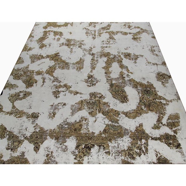 ACTUAL SIZE: 10’2″ x 12’2″ PRIMARY COLOR: Ivory / Tan AGE: Old ORIGIN: Iran MATERIALS: Wool FOUNDATION: Cotton PRODUCTION:...