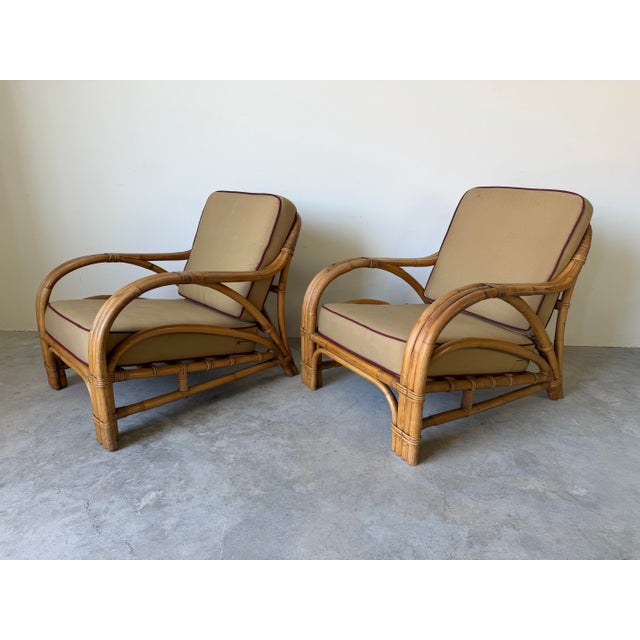 Charming and timeless, this pair of mid-century lounge chairs is designed in the iconic Paul Frankl style, featuring...