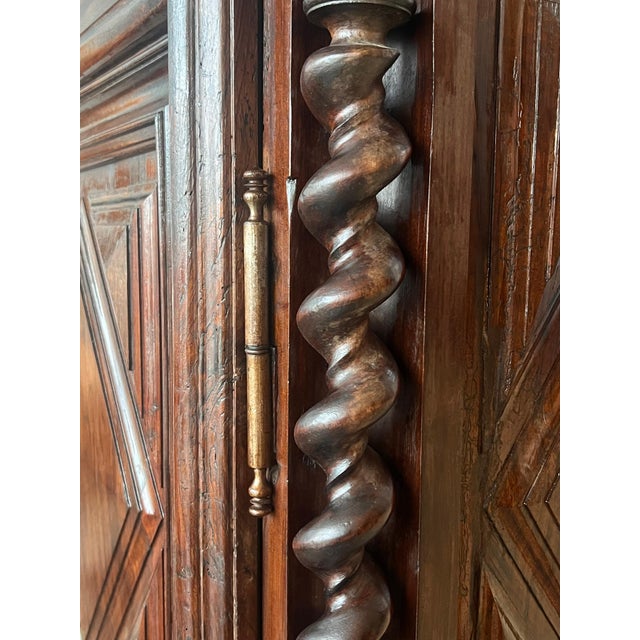 An exquisite Dutch cushion cabinet with two doors. This cupboard takes its name from the pillow-shaped thickenings on the...