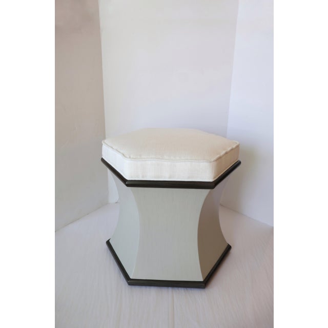 A hexagonal seat is raised on a hexagonal base with #65 Graystone and #63 Charcoal accents. Material: Hardwood Solids...