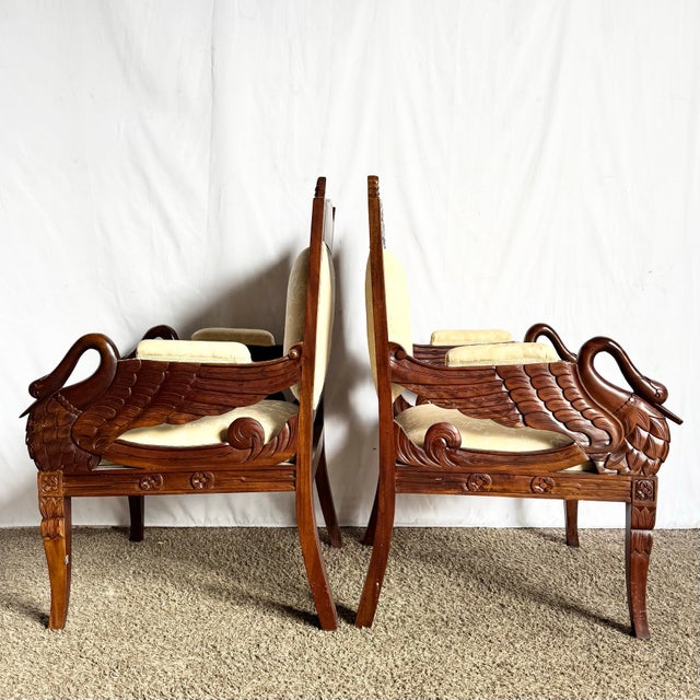 This exquisite pair of carved wooden swan arm chairs brings a sense of romance and artistry to any interior. Each chair...