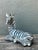 This captivating vintage zebra figurine is a quintessential example of Hollywood Regency glamour and maximalist style....