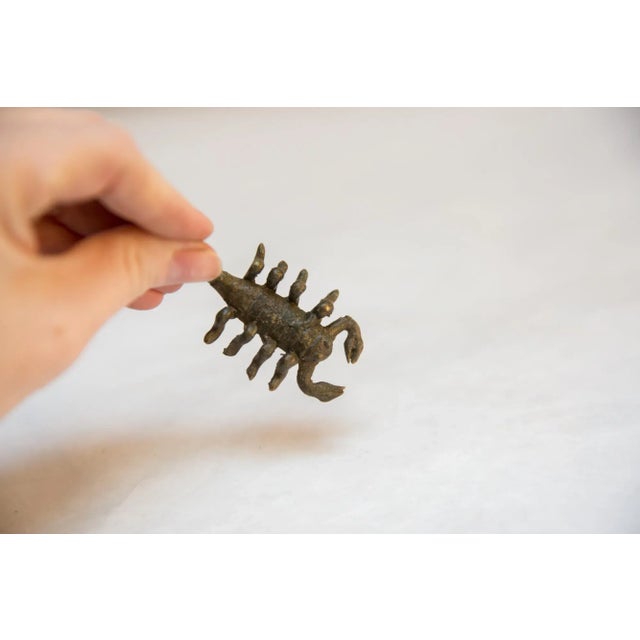 Vintage handmade African dark bronze scorpion. Circa mid 20th century and possibly older, this piece has such incredible...
