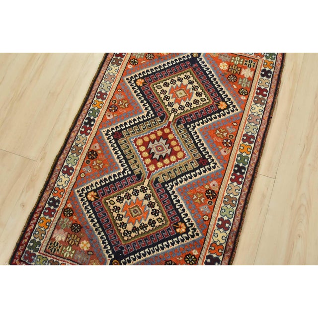An authentic vintage tribal Yalameh rug hand-knotted with fine wool and natural dyes. This nomadic oriental rug features...