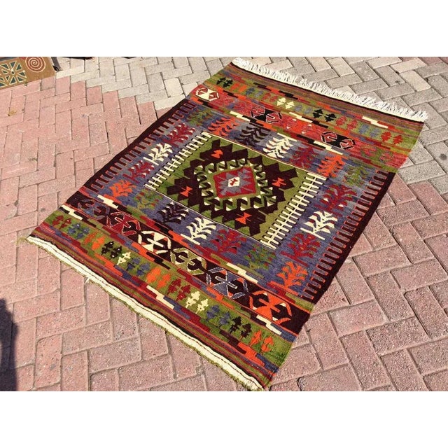 This beautiful, vintage, handwoven kilim is approximately 60 years old. It is handmade, of very fine quality hand spun...