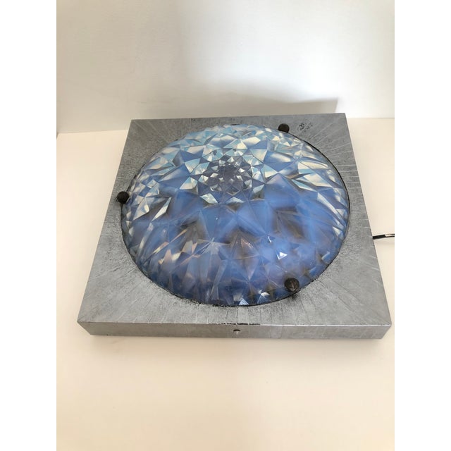 This is a beautiful, well kept Hunnebelle light fixture from the 1920's. The framework is iron and the glass portion...