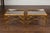 A pair of French vintage gilt faux bamboo drinks tables from the mid-20th century, with glass tops and X-form cross...