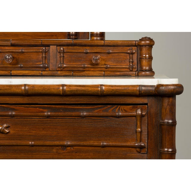 Striking late 19th century French Napoleon III faux bamboo dresser with mirror, sourced in Paris, France. Crafted in pine...