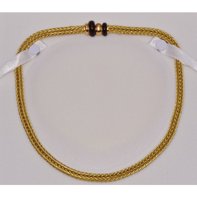 Authentic Italian 18K yellow gold woven braided enamel necklace. This exceptional necklace features a highly intricate...