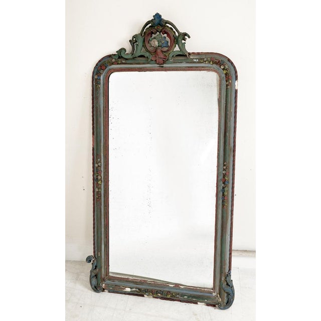 A very elegant late 19th century mirror bought in Belgium, featuring an elaborate wood and plasterwork surround with faded...