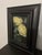 This oil painting depicts a pair of yellow peonies, their lush petals rendered with soft, fluid brushstrokes that evoke a...