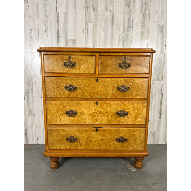 Solid pine with hand painted faux grain design and faux burl on the drawer fronts. Rococo Revival drawer pulls add to this...