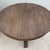 Ground your interior with the elemental beauty and rugged charm of this vintage primitive round center table. Crafted from...