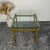 This exclusive square side table embodies the luxurious glamour of the 1970s. The frame is made of heavy brass, adorned on...