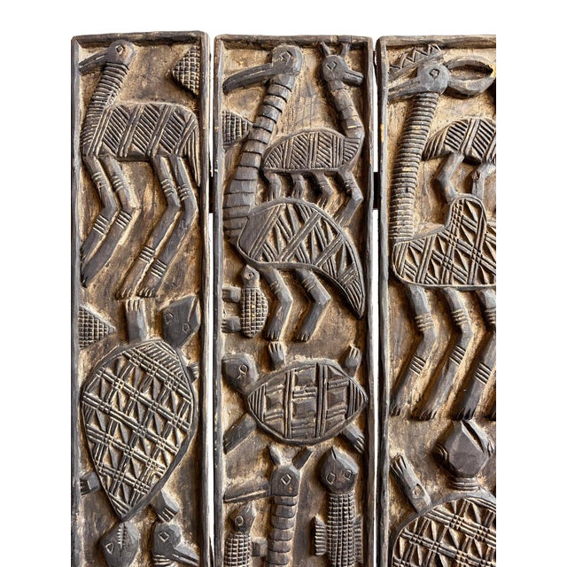 An exceptional piece of traditional Nigerian craftsmanship, this vintage Nupe wooden door panel showcases an intricate...