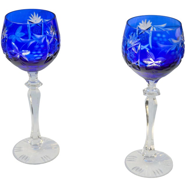 Gorgeous set of two midcentury handblown heavy cut-to-clear crystal glasses. Exhibiting an elegant textured hand-cut...