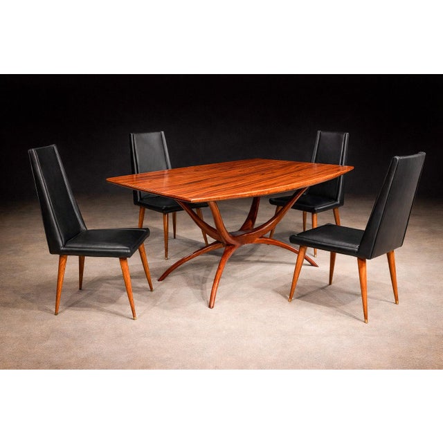 Designed by Giuseppe Scapinelli (1891–1982) in the 1950s, this set of four dining chairs reflects the designer’s...