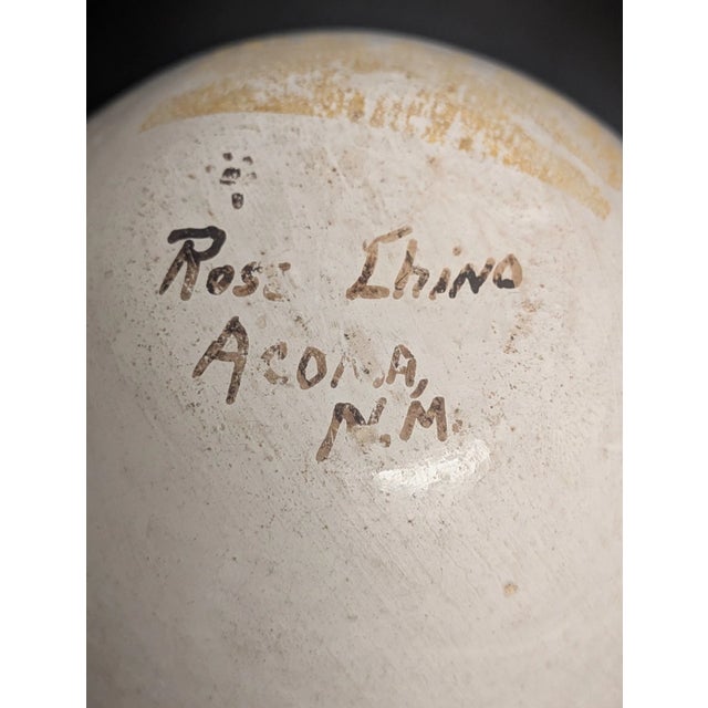 Hand-painted Acoma, New Mexico pottery vase signed Rose Chino on the underside. Features an intricate black-and-white...