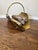 Bring warm metallic texture and sculptural style to your hearth with this large vintage hammered brass log holder. Its...