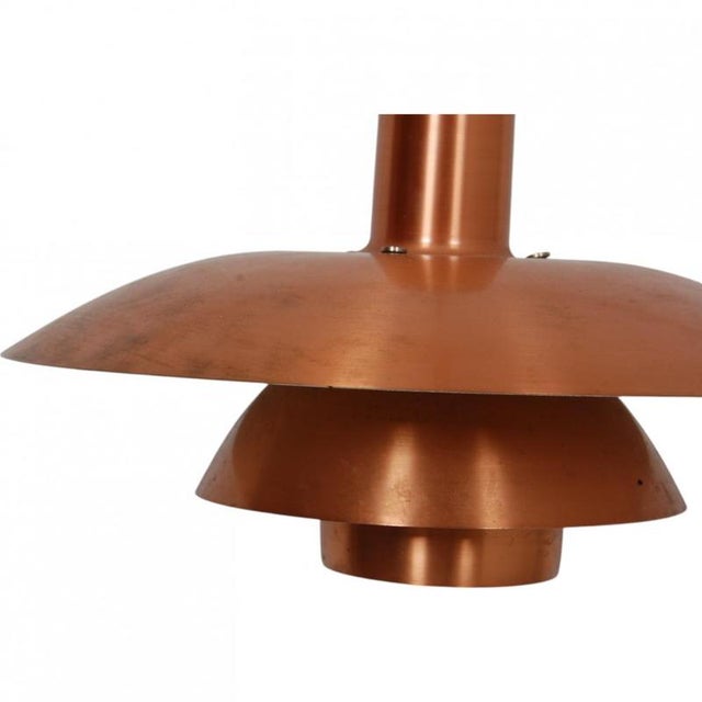 Poul henningsen ph 4/4 pendant lamp with copper shades from the 1970s. The lamp appears in good condition but with...