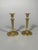 Pair of gilt bronze candlesticks, Empire period, early 19th century. Hexagonal stems resting on a sphere, itself on a...