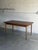 This highly functional dining table features a rectangular top with two seamless draw leaves. The clean lines and elegant...