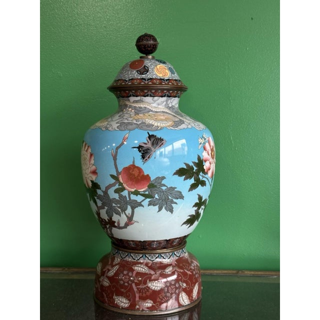 A highly impressive and unusually large Japanese cloisonné enamel lidded vase, standing 18 inches tall and constructed in...