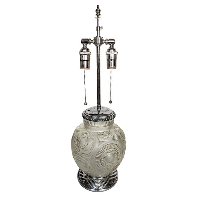 This table lamp was created by the French artist " Marius Ernest Sabino " in great condition. Enhanced by geometrical...