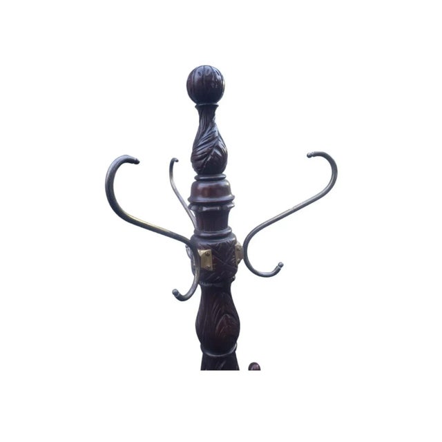 A beautiful George III style mahogany hand carved coat and hat rack with Tripod paw feet. Features 3 brass scrolled hooks...