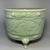 Fine antique Chinese celadon tripod censer. Cylindrical body decorated with carved scrolling floral patterns, supported by...