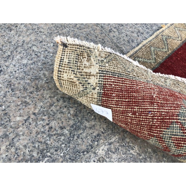 This is a vintage Turkish Oushak rug from the 1960s. The piece was hand-knotted.