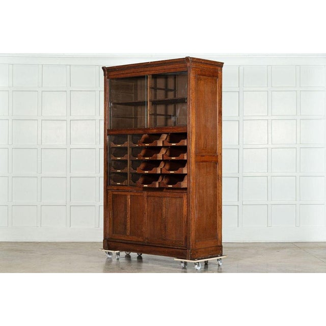 Circa 1900 English Oak Glazed Haberdashery Cabinet. W135 x D59 x H213 cm Weight 150 kg.