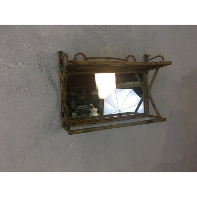 This great vintage piece will hold a hand towel but also has a mirror. It is both decorative and useful