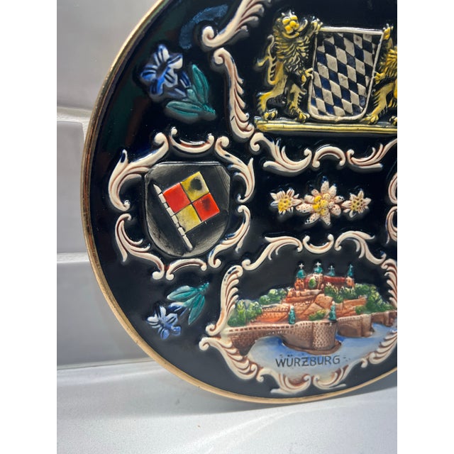 German relief pottery collectible plate for the city of Wurzburg. Wonderful colors! Hanger on back.