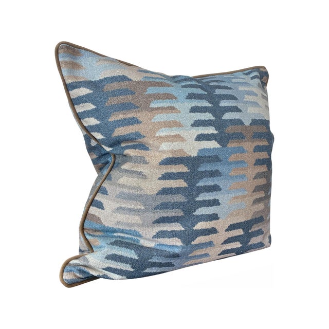 Infused with a playful palette of blues this fabric features a modern, stepped pattern that brings an artistic energy to...