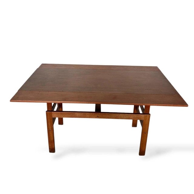 The Metamorphic Coffee Table is a versatile mid century modern table designed to transform effortlessly from a compact...