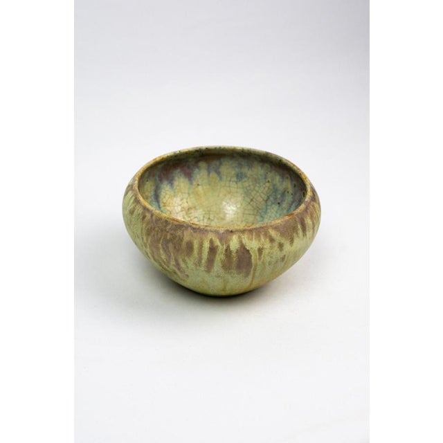 Bearing the rectangular stamp dated 1914, the artist's signature, and the model number 1 beneath the base, this bowl is a...