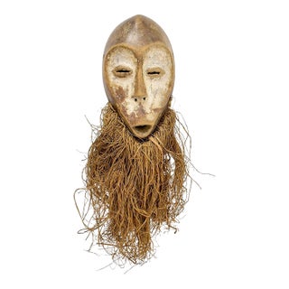 Early 20th Century Lega Bwami Society Mask with Raffia For Sale