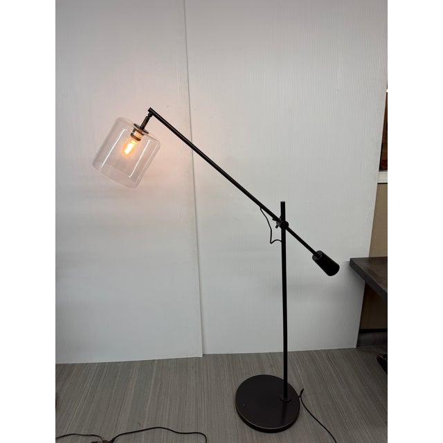 Design Plus Gallery presents an Industrial Floor Lamp from West Elm. The sleek, modern design is minimal and chic in black...